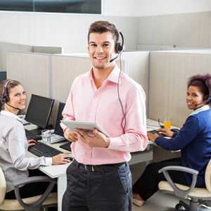 Employees wearing headset in office